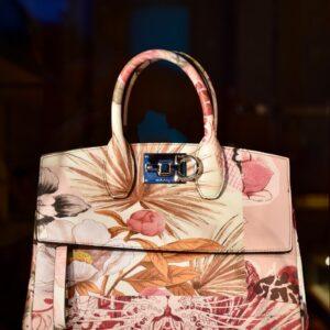 white and red floral handbag